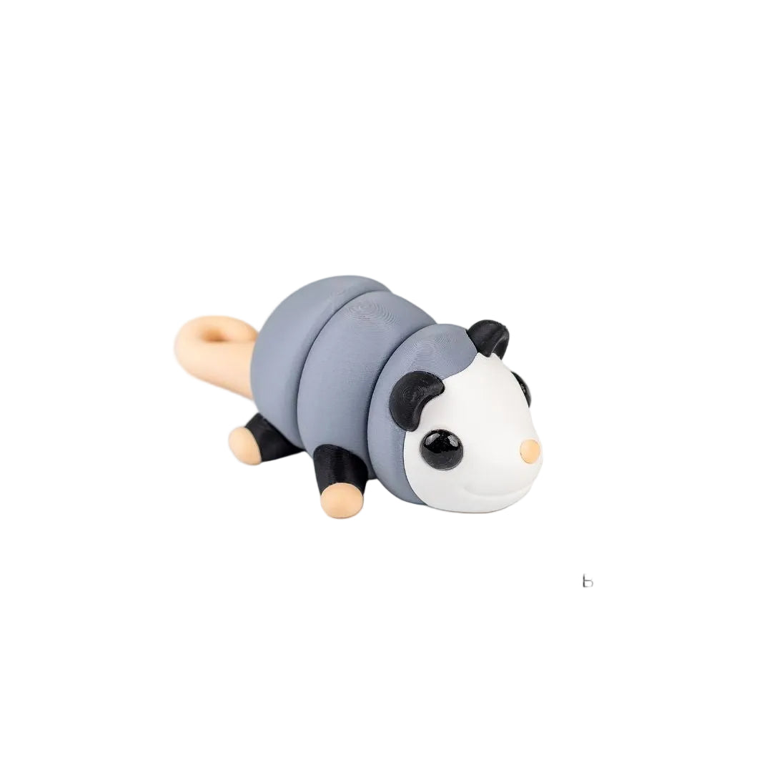 Model of a baby opossum toy on a white background